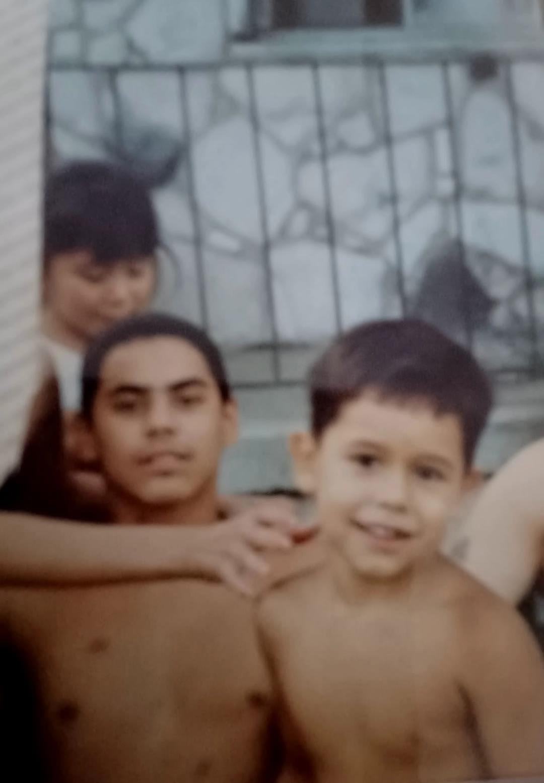 SIN as a child with his uncle Jody